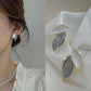 Boucle d'oreille fleurs dorées