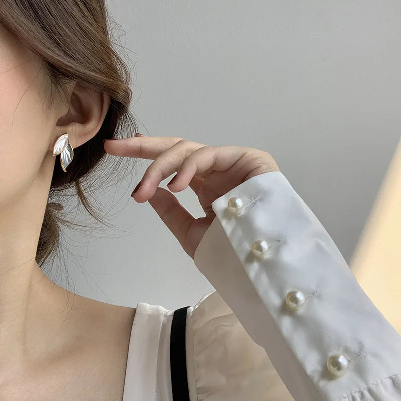 Boucle d'oreille fleurs dorées